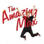 The Amazing Max jumping through text that reads "The Amazing Max". His arms are raised and his feet seems to be high off the ground with an excited look on his face.