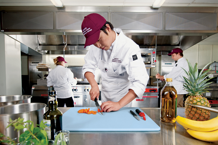 Students cooking in the kitchen of the Marriott Hospitality Center.