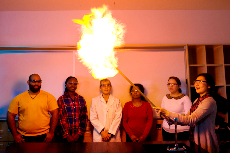 A chemical reaction is demonstrated in Professor Susan Bontems' chemistry class.
