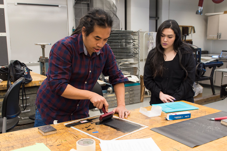 Raj Bunnag demonstrated techniques for making linocuts, inking, and printing, and then worked with students to carve blocks for printing.