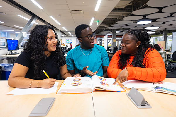 Raptor Reps Karel Lirio and Bamby talking and reviewing course material