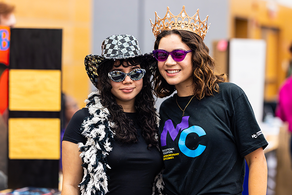 Raptor Reps posing for a photo with costumes on