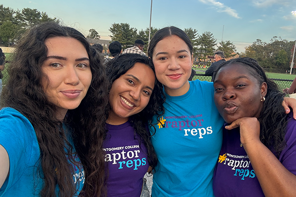 Raptor Reps taking a selfie at an athletic field