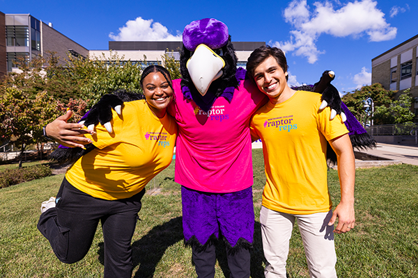 Raptor Rep sMalia and Maro posing for a picture with the MC Raptor