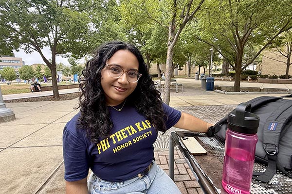 Liro standing outside on campus